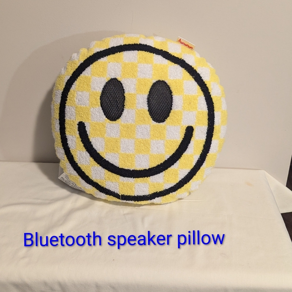 Iscream Yellow and Black Smiley Face Pillow With Bluetooth Speakers In The Eyes.